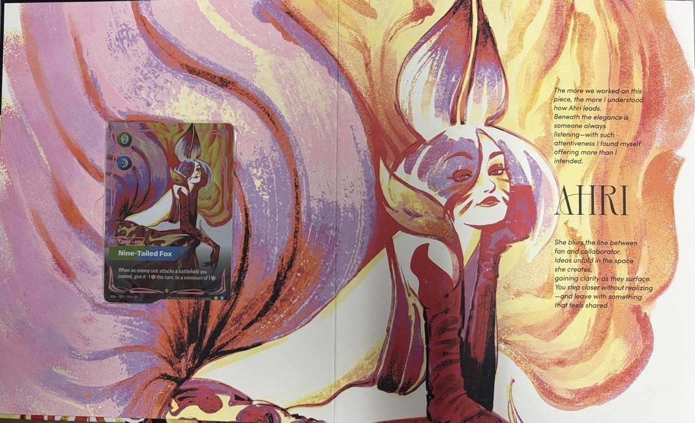 Ahri page in the leaked Riftbound K/DA Volume 001 box, with the Nine-Tailed Fox Legend in alt art