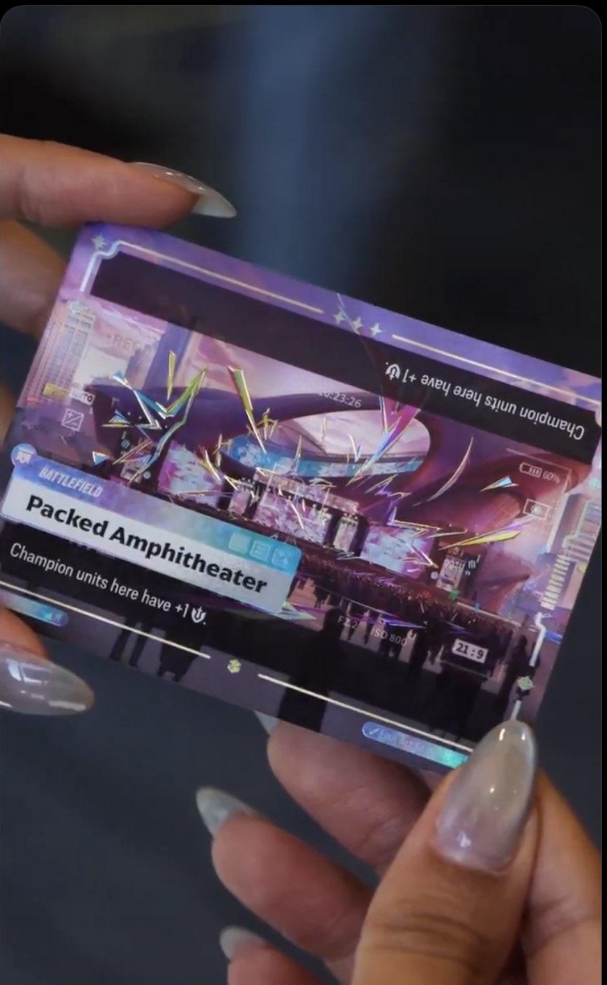 The Packed Amphitheater Ultimate Rare card from Riftbound Radiance held in hand