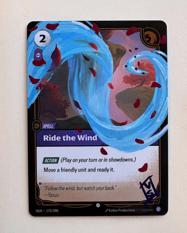 La carta Ride the Wind ridipinta a mano da Rekla, un vortice azzurro e petali